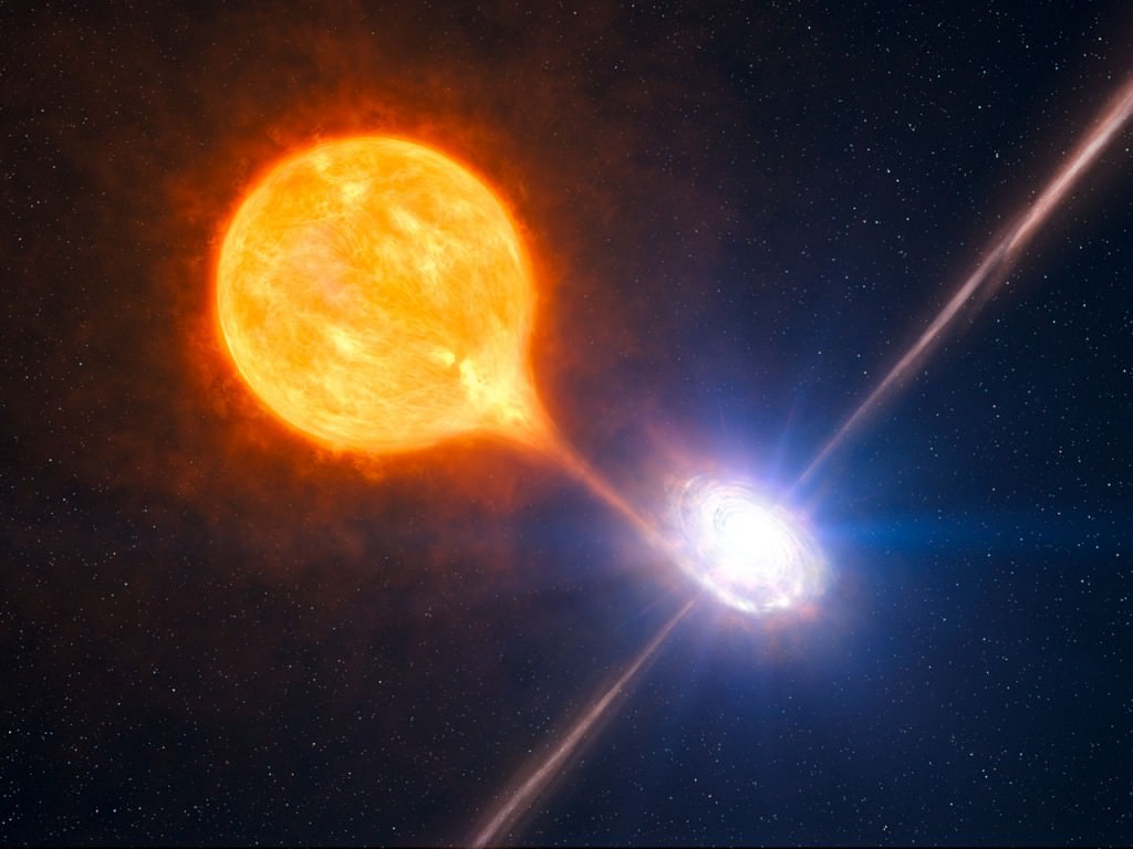 Artist's impression of a Star feeding a black hole.  The authors of this study say that the regular flaring of GSN 069 is caused by the remnant of a star interacting with the disk of material around the black hole. Credit: ESO/L. Calçada