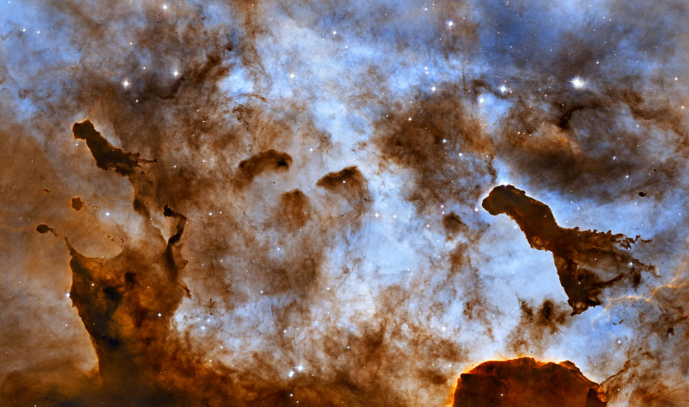 Dust Pillars in the Carina Nebula. Astronomers are peering inside Carina's pillars to get new details about starbirth activities. Credit: NASA, ESA, and the Hubble Heritage Project (STScI/AURA) Acknowledgment: M. Livio (STScI) and N. Smith (University of California, Berkeley)