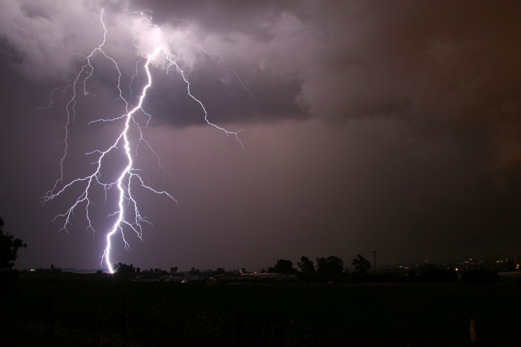 This photograph shows a lightning storm striking a rural area. Here on Earth, lightning produces ozone and may also have been the energetic trigger that got life going. Credit: noaanews.noaa.gov