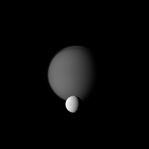 Titan and Tethys line up for a portrait of 'sibling' moons. Credit: NASA/JPL/Space Science Institute