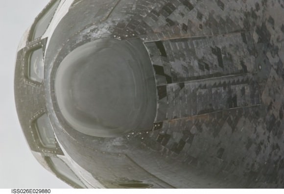 This view of the nose, the forward underside and crew cabin of the space shuttle Discovery was provided by an Expedition 26 crew member during a survey of the approaching STS-133 vehicle prior to docking with the International Space Station. Credit: NASA