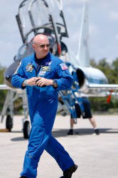 STS-134 commander Mark Kelly strides across the runway of the Shuttle Landing Facility. Credit: Michael Deep, for Universe Today.