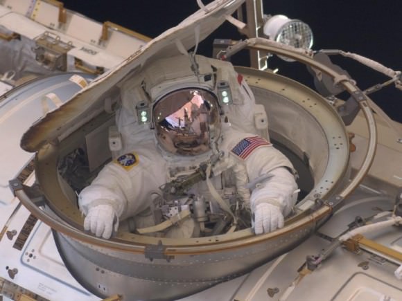 Astronaut Drew Feustel reenters the space station after completing an 8-hour, 7-minute spacewalk at on  Sunday, May 22, 2011. He and fellow spacewalker Mike Fincke conducted the second of the four EVAs during the STS-134 mission. Credit: NASA