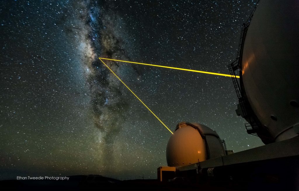 The twin Keck telescopes shooting their laser guide stars into the heart of the Milky Way on a beautifully clear night on the summit on Mauna Kea. Credit: keckobservatory.org/Ethan Tweedie