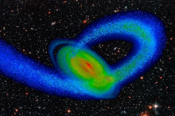 Computer model of the Milky Way and its smaller neighbor, the Sagittarius dwarf galaxy. The flat disk is the Milky Way, and the looping stream of material is made of stars torn from Sagittarius as a result of the strong gravity of our galaxy. The spiral arms began to emerge about two billion years ago, when the Sagittarius galaxy first collided with the Milky Way disk.   Image by Tollerud, Purcell and Bullock/UC Irvine 