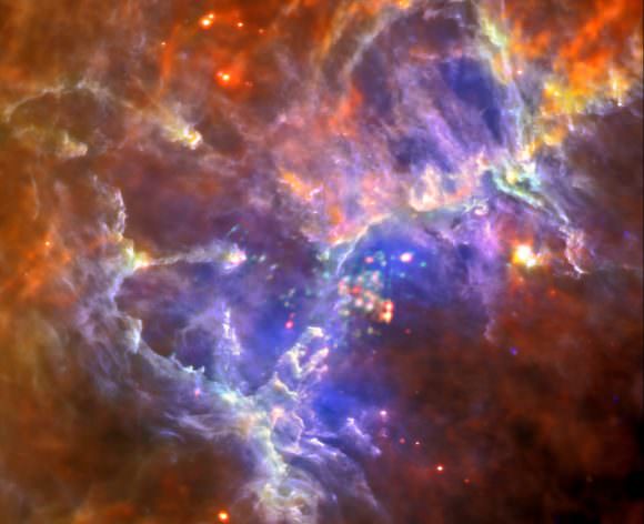 A new look at M16, the Eagle Nebula in this composite from the Herschel telescope in far-infrared and XMM-Newton in X-ray. Credits: far-infrared: ESA/Herschel/PACS/SPIRE/Hill, Motte, HOBYS Key Programme Consortium; X-ray: ESA/XMM-Newton/EPIC/XMM-Newton-SOC/Boulanger