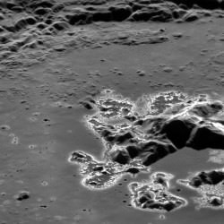 MESSENGER captures image of curious "hollows" around a crater peak