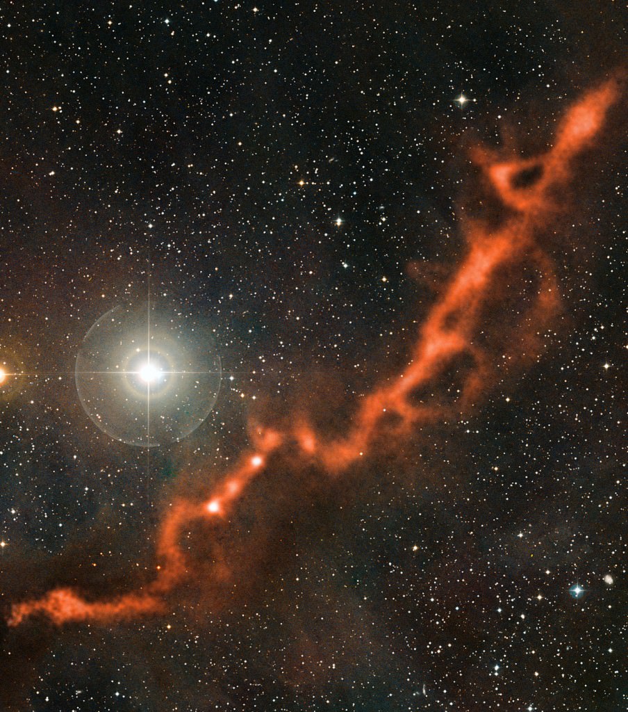 Molecular clouds like this one are the birthplace of stars. This image from the APEX telescope, of part of the Taurus Molecular Cloud, shows a sinuous filament of cosmic dust more than ten light-years long. Credit: ESO/APEX (MPIfR/ESO/OSO)/A. Hacar et al./Digitized Sky Survey 2. Acknowledgment: Davide De Martin.