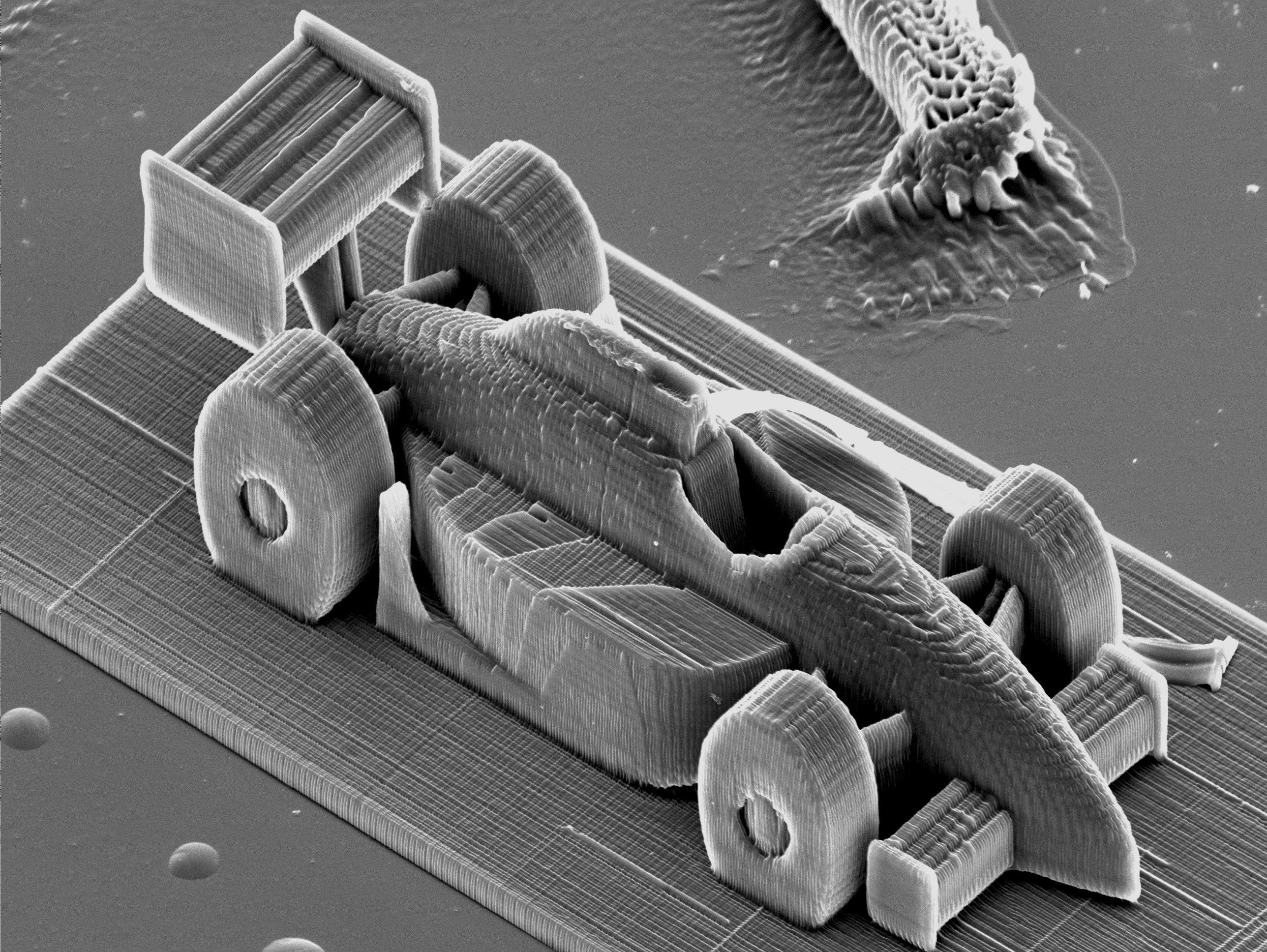 3D printing of a microscopic race car. Image credit: TU Vienna