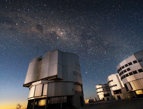 The Very Large Telescope (VLT) at ESO's Cerro Paranal observing site.  Located in the Atacama Desert of Chile, the site is over 2600 metres  above sea level, providing incredibly dry, dark viewing conditions. The  VLT is the worldâ??s most advanced optical  instrument, consisting         of four Unit Telescopes with main mirrors 8.2-m in diameter and   four movable 1.8-m diameter Auxiliary        Telescopes. The telescopes  can work together, in groups of two or  three, to form a giant  interferometer, allowing astronomers to see  details up to 25 times  finer than with  the individual telescopes. Credit: European Southern Observatory