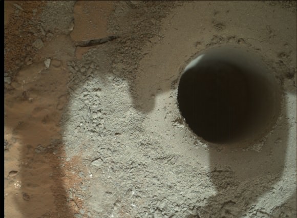 What a hole on Mars ! Alien hole on an Alien Planet. Curiosity precisely bores to a depth of 2.5 inches (64 mm) into water altered rock. Credit: NASA/JPL-Caltech/MSSS