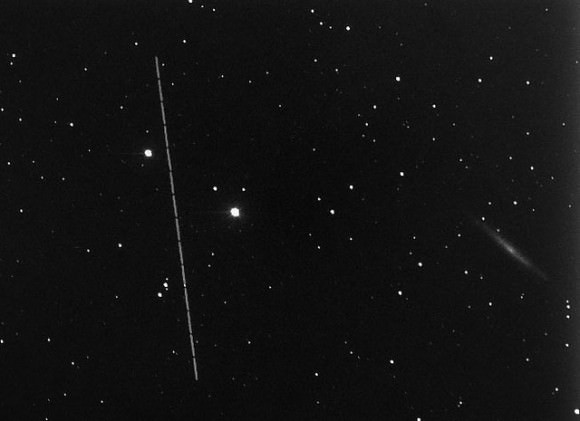 Asteroid 2012 DA14 flies by NGC 4244 at a distance of 14 million light years. Credit and copyright: David G. Strange.