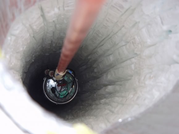 Looking down one of IceCube's detector bore holes. (Credit: IceCube Collaboration/NSF). 