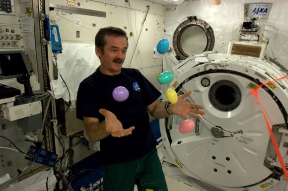 Canadian astronaut Chris Hadfield attempts to juggle Easter eggs aboard the International Space Station. Do they go splat ??. Credit: NASA