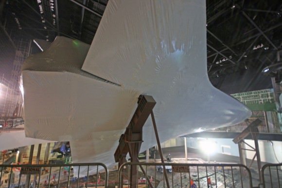 Plastic wrapped Space Shuttle Atlantis tilted at 43.21 degrees and mounted on pedestals at the Kennedy Space Center Visitor Complex in Florida.  Credit: Ken Kremer (kenkremer.com)