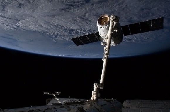 The SpaceX Dragon capsule is snared by the International Space Station's Canadarm 2. Credit: NASA