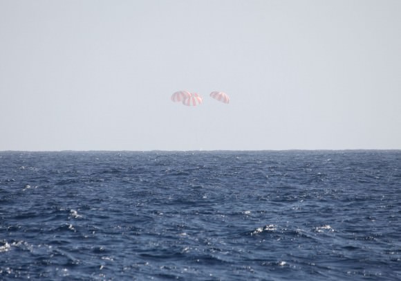 This picture captures the Dragon just as it hits the water in the Pacific Ocean. Credit: SpaceX.