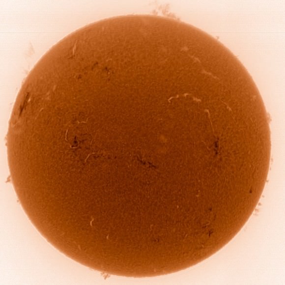 A negative image of the Sun and large prominences on March 31, 2013. Credit and copyright: César Cantú.