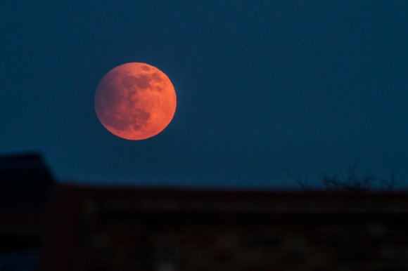 Partially eclipsed Moon rising over Brixton in the UK on April 25, 2013. Credit and copyright: Owen Llewellyn. 