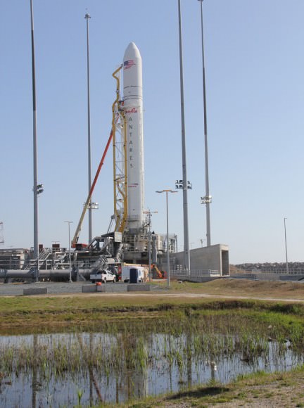 1st fully integrated Antares rocket stands firmly erect at seaside Launch Pad 0-A at NASA’s Wallops Flight Facility on 16 April 2013.  Technicians were working at the pad during my photoshoot today. Maiden Antares test launch is scheduled for 17 April 2013. Later operational flights are critical to resupply the ISS. Credit: Ken Kremer (kenkremer.com)