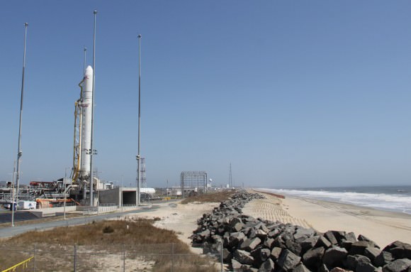 Antares rocket erect at the Eastern shore of Virginia slated for maiden liftoff on April 17.  Only a few hundred feet of beach sand and a miniscule sea wall separate the Wallops Island pad from the Atlantic Ocean waves and Mother Nature.  Credit: Ken Kremer (kenkremer.com)
