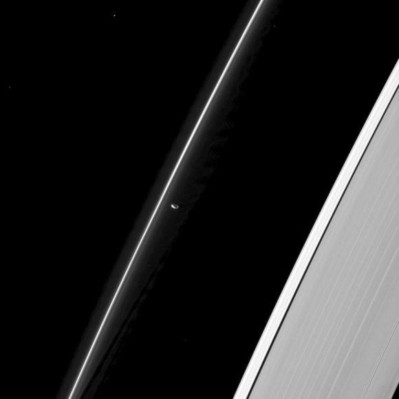 Prometheus keeps lonely watch over Saturn's F-ring in this image from NASA's Cassini mission. This view looks toward the unilluminated side of the rings from about 52 degrees below the ringplane. The image was taken in visible light with the Cassini spacecraft narrow-angle camera on Jan. 15, 2013. 