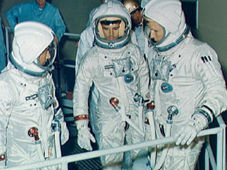 The Apollo 1 crew training at North American's Downey Facility. Note the flags aren't on the spacesuits in this shot. Left to right: Virgil "Gus" Grissom Roger Chaffee, Edward White. Credit: NASA