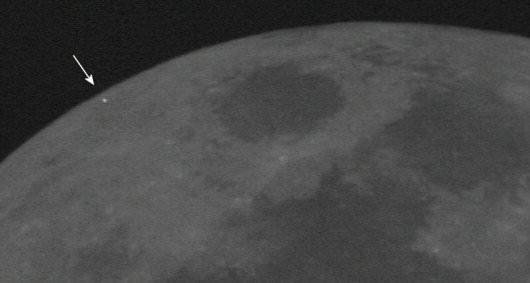 Flash of a Leonid impact captured on the limb of the Moon in 2006. Click image  to see animation. (Credit: NASA Meteoroid Environment Office). 