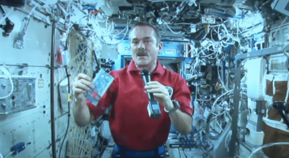 Canadian astronaut Chris Hadfield holds a version of the $5 bill on the International Space Station on April 30, 2013. Credit: Bank of Canada (webcast)