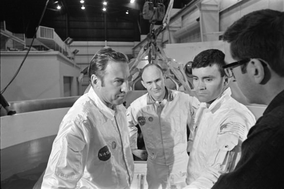 Apollo 13's original crew of Jim Lovell, Ken Mattingly and Fred Haise with an unidentified person. Credit: NASA