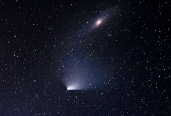 The encounter between Comet PANSTARRS and the Andromeda Galaxy, as seen from Ireland. 'A difficult image to capture due to low cloud, the low altitude of the target and tracking Issue.'  Image details: Date: 03 Apr 2013, 22:30-23:30 Exposure: 9 x 5min, ISO 1600, F5, 6 x dark frames, 6 x flats frames. Equipment: Canon 1000D, CG5 Mount, Sigma 70-300mm set at 200mm. Credit and copyright: Brendan Alexander. 