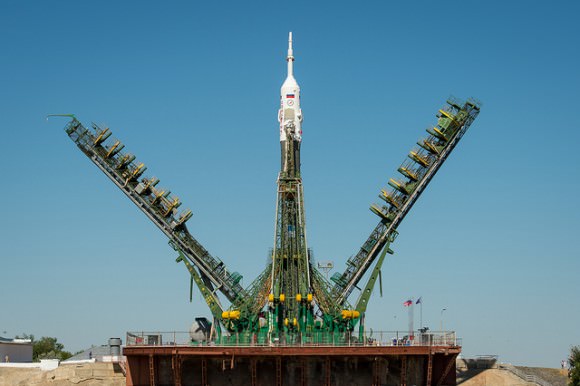 The Service arms are raised into position around the Soyuz rocket, with the TMA-09M spacecraft, after arriving at the Baikonur Cosmodrome launch pad by train, Sunday, May 26, 2013, in Kazakhstan. Credit: NASA/Bill Ingalls.