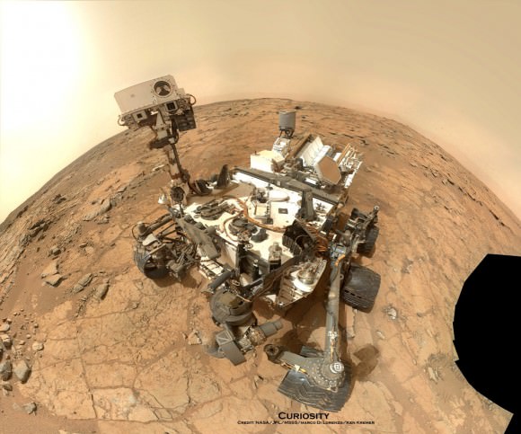 Curiosity Rover snapped this self portrait mosaic with the MAHLI camera while sitting on flat sedimentary rocks at the “John Klein” outcrop where the robot conducted historic first sample drilling inside the Yellowknife Bay basin, on Feb. 8 (Sol 182) at lower left in front of rover. The photo mosaic was stitched from raw images snapped on Sol 177, or Feb 3, 2013, by the robotic arm camera - accounting for foreground camera distortion. Credit: NASA/JPL-Caltech/MSSS/Marco Di Lorenzo/KenKremer (kenkremer.com). 