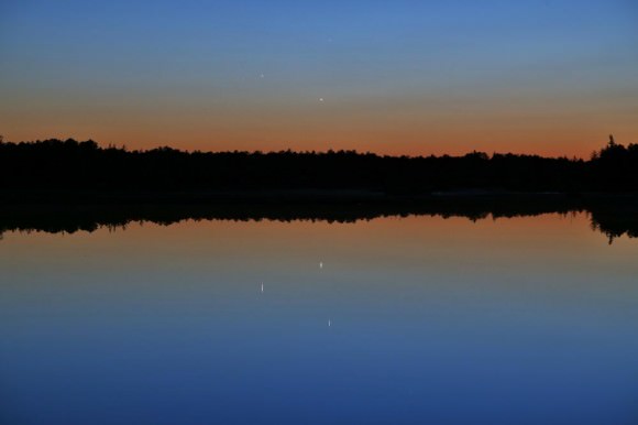 Jupiter, Venus and Mercury triple conjunction May 26 seen here reflecting off Chatsworth Lake in Chatsworth, NJ. Jupiter (on the left) was 2.4° from Mercury (upper-right in the sky) and 2.0° from Venus (bottom right in the sky), while Venus and Mercury were 1.9° apart. Venus was at 2.6° altitude. Canon EOS 6D, 105 mm focal length, 1.3 seconds, f/6.3, ISO 800. Credit: Joe Stieber - sjastro.org/