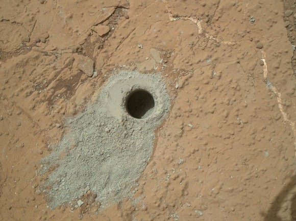 NASA's Mars rover Curiosity drilled into this rock target, "Cumberland," during the 279th Martian day, or sol, of the rover's work on Mars (May 19, 2013) and collected a powdered sample of material from the rock's interior. Analysis of the Cumberland sample using laboratory instruments inside Curiosity will check results from "John Klein," the first rock on Mars from which a sample was ever collected and analyzed. The two rocks have similar appearance and lie about nine feet (2.75 meters) apart. Image Credit: NASA/JPL-Caltech/MSSS