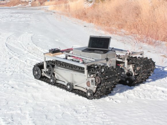 A prototype of GROVER during testing in January 2012. The rover does not have its solar panels attached here. The laptop was used as part of that specific test only. Credit: Gabriel Trisca, Boise State University