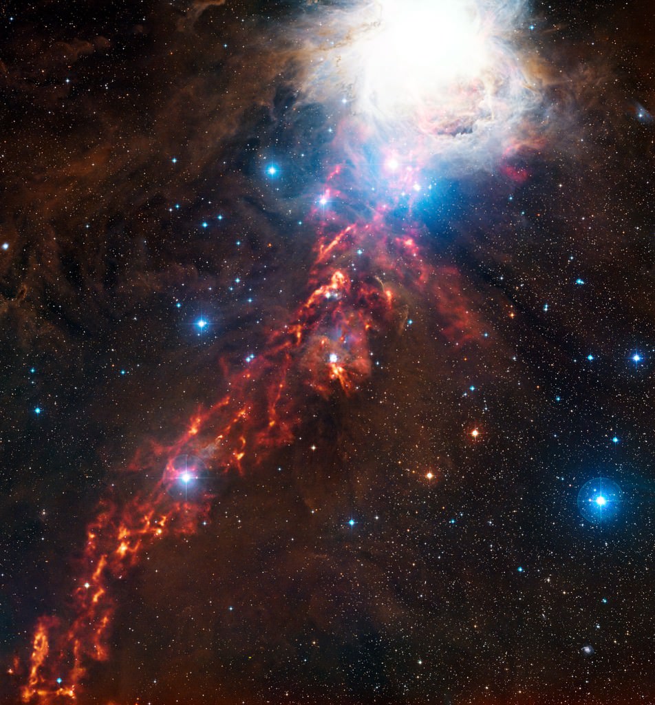 In this image of nebulae in the Orion Molecular Complex, the submillimetre-wavelength glow of dust clouds is overlaid on a view of the region in the more familiar visible light, from the Digitized Sky Survey 2. The large orange bar extended down to the lower left is the Orion A portion of the Complex. The large bright cloud in the upper right of the image is the well-known Orion Nebula, also called Messier 42. (Credit: ESO/Digitized Sky Survey 2.) Now astronomers have a new tool to understand nebulae like this one: 3D mapping using Gaia data.