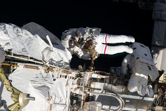 Expedition 35 Flight Engineers Chris Cassidy (left) and Tom Marshburn on a spacewalk on May 11 to inspect and replace a pump controller box on the International Space Station’s far port truss (P6) leaking ammonia coolant. Credit: NASA.