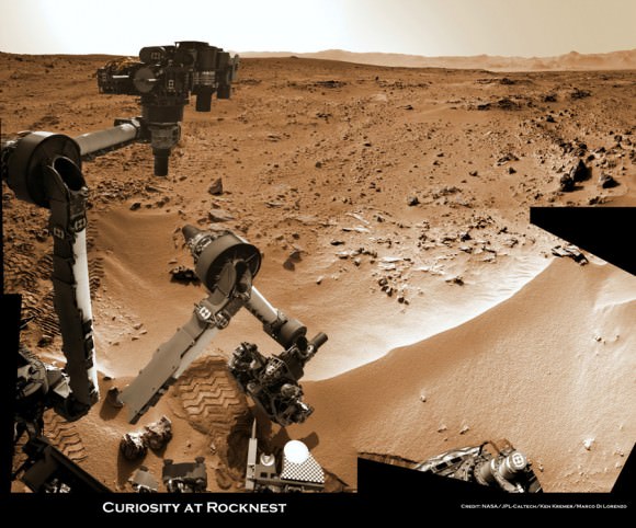 Time lapse context view of Curiosity maneuvering her robotic arm to conduct close- up examination of windblown ‘Rocknest’ ripple site.  Curiosity inspects “bootlike” wheel scuff mark with the APXS (Alpha Particle X-Ray Spectrometer) and MAHLI (Mars Hand Lens Imager) instruments positioned on the rotatable turret at the arm’s terminus. Mosaic stitched from Navcam images on Sols 57 & 58 shows the arm in action just prior to 1st sample scooping here. Eroded rim of Gale Crater rim is visible on the horizon. Credit: NASA/JPL-Caltech/Ken Kremer (kenkremer.com)/Marco Di Lorenzo