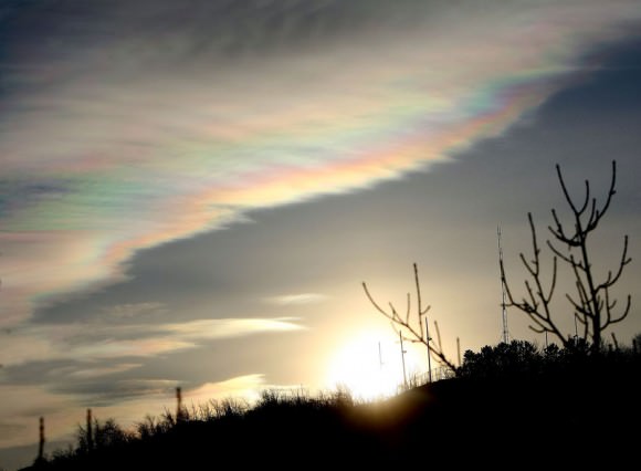 Iridescent clouds are another form of a corona formed by minute water droplets diffracting light. Credit: Bob King