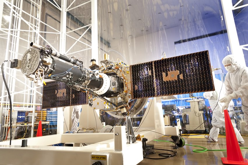 Technicians work on NASA’s Interface Region Imaging Spectrograph (IRIS) in a "clean room", a specially designed facility intended to minimize contaminants on spacecraft before launch. Credit: Lockheed Martin
