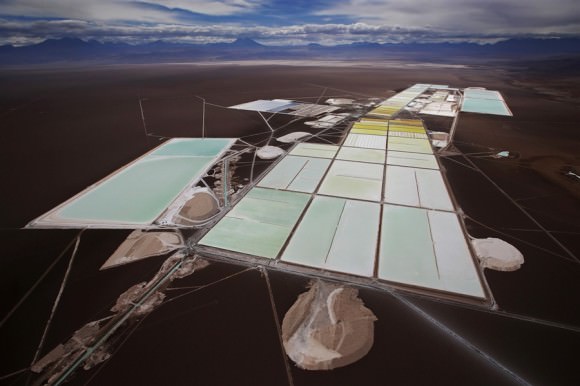 An aerial view of the brine pools and processing areas of the Soquimich lithium mine on the Atacama salt flat, the largest lithium deposit currently in production, in the Atacama desert of northern Chile, on Jan. 10, 2013. Credit: Ivan Alvarado / Reuters.