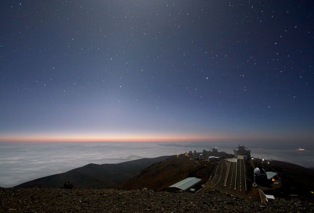 Moonlight and zodiacal light lights up the skies over ESO's La Silla observatory.  Zodiacal light is thought to be sunlight reflected from dust concentrated in the plane of the zodiac or ecliptic. (Credit: Alan Fitzsimmons/ESO)