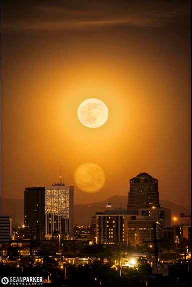 A 3-photo HDR image of the supermoon rising over downtown Tucson, Arizona. During the longer exposure the Moon gave out its own flare due to its intensity. Credit and copyright: Sean Parker/Sean Parker Photography. 