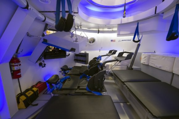 This is an interior view of The Boeing Company's CST-100 spacecraft, which features LED lighting and tablet technology.  Image Credit: NASA/Robert Markowitz