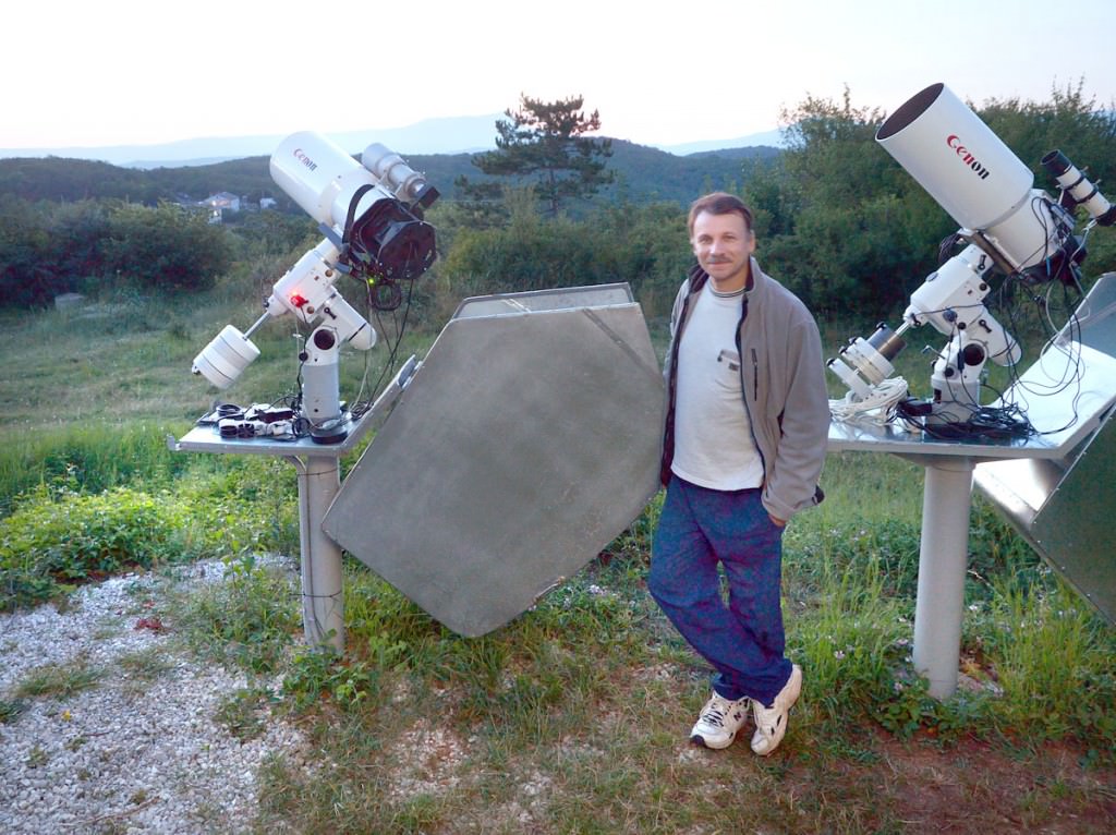 Gennady Borisov, who lives in Naunchniy near the Crimean Observatory in the Ukraine, discovered the comet C/2013 N4 on July 8. He's shown here with his two telescopes. Credit: Oleg Bruzgalov