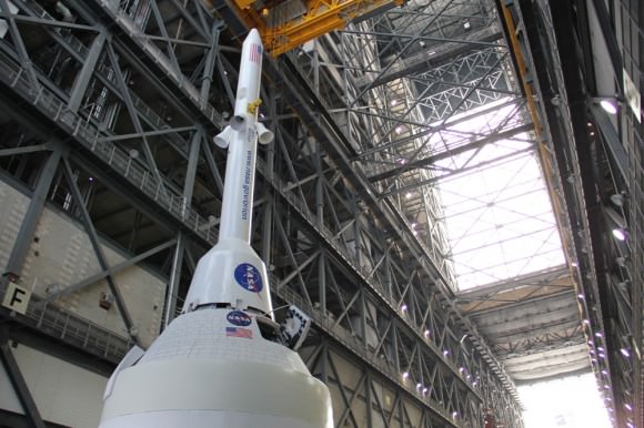 Technicians work on mockups of the Orion crew capsule, Service Module and 6 ton Launch Abort System (LAS) to simulate critical assembly techniques inside the Vehicle Assembly Building (VAB) at NASA’s Kennedy Space Center (KSC) in Florida for the EFT-1 mission due to liftoff in September 2014. Credit: Ken Kremer/kenkremer.com 
