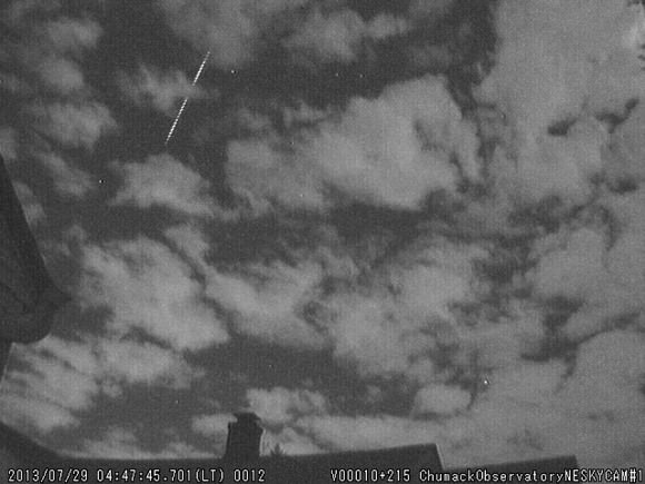 A Delta Aquarid meteor shows up through the clouds on July 29, 2013. Credit and copyright: John Chumack. 