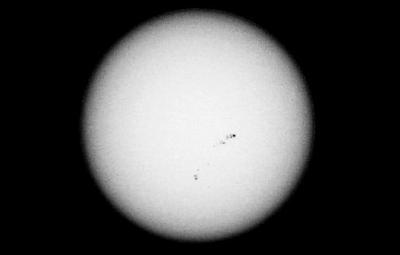 The sunspot group visible using a simple camera and eclipse glasses. Credit: Daniel Fischer