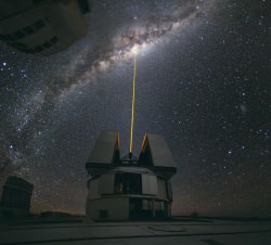 A beam from the Laser Star Guide on one of the VLT's four Unit Telescopes helps to correct the blurring effect of Earth's atmosphere before making observations (ESO/Y. Beletsky)